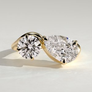Pear and Round Stone Twist Toi et Moi Ring