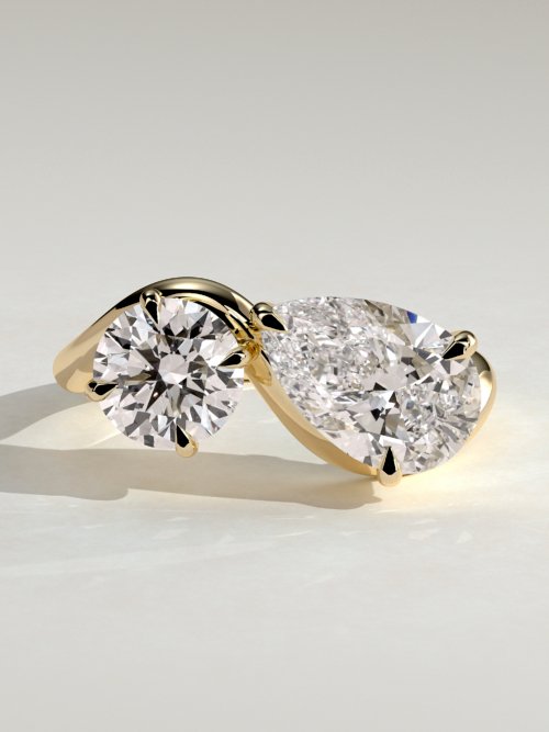 Pear and Round Stone Twist Toi et Moi Ring