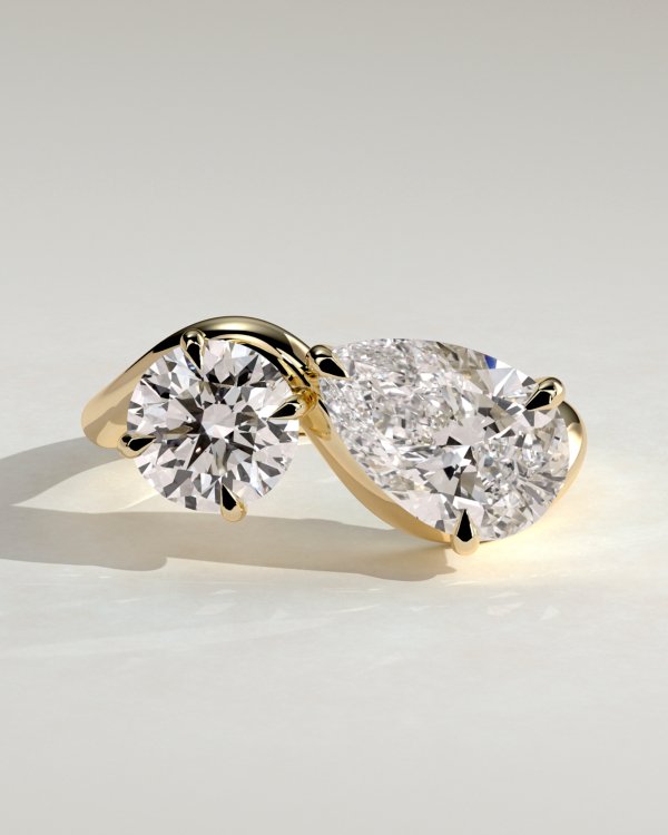 Pear and Round Stone Twist Toi et Moi Ring