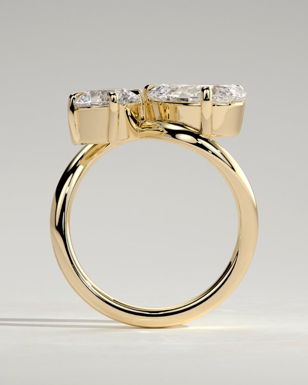 Pear and Round Stone Twist Toi et Moi Ring