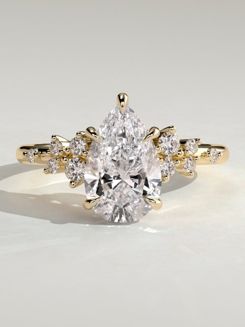 Pear Solitaire with Clustered Stones Engagement Ring