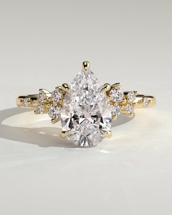 1fvgabypmt57ur8pxmgw2wulamltgk7c_6f70deb878cb96c657a43a9cdfa49bd1 Pear Solitaire with Clustered Stones Engagement Ring