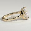 1grklmwra0a1bsta66cipjtt29txrbuue_41f828b1d6e641d314fc4491e05eaea0 Pear Solitaire with Clustered Stones Engagement Ring