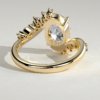 Oval Solitaire with Clustered Accent Stones Engagement Ring