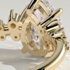 1lw9o2kvgieki1q3cvyjozvl_uby2gbar_7ba1be6813526591175999b058d55940 Pear Solitaire with Clustered Stones Engagement Ring