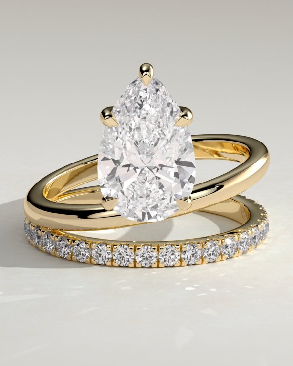 1mcc9vde0s_gruxxubi305wmjmknfewgq_020b0de4b0a0ba517cdada827873f0c1 Double Band Pear Solitaire Engagement Ring