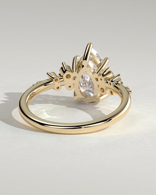 1pl5r5wmpzfwnxpacxges_ox4j7mogkr6_9e519102c1fd712504b5dcc97ce64694 Pear Solitaire with Clustered Stones Engagement Ring