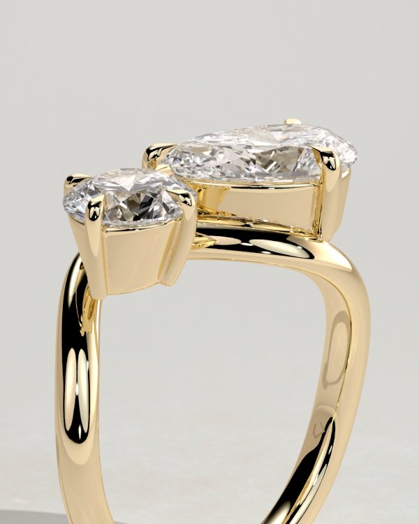 Pear and Round Stone Twist Toi et Moi Ring