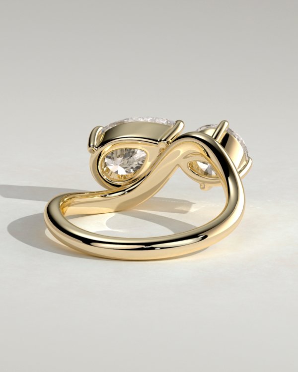 Pear and Round Stone Twist Toi et Moi Ring