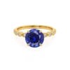 HopeRoundBlueSapphireLabDiamondEngagementRingYellowGold4ProngShoulderSetLilyArkwright1_1024x.jpg Round Blue Sapphire Shoulder Set Engagement Ring